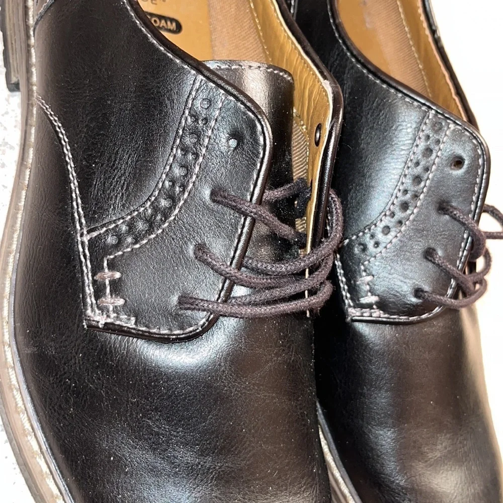 Brand New Never worn Men Dress shoes. Black with black laces.